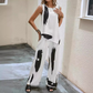 Top asimetric fără mâneci și set de pantaloni cu picioare largi
